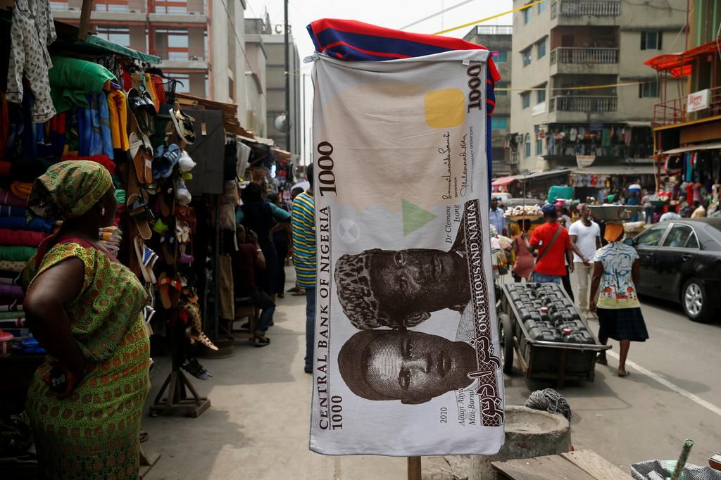 A towel with a print of the Nigerian naira is displayed for sale at a street market - February 4, 2016. REUTERS/Akintunde Akinleye/File Photo