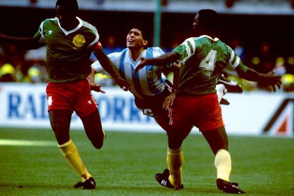 Cameroon players against Maradona