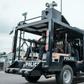 A member of the SWAT police unit straddles a machine gun outside a vote collation centre in Port Harcourt, Nigeria's oil hub