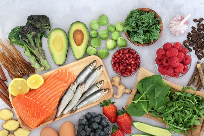 Anti-inflammatory foods like berries, leafy greens, and seafood can help manage your body's stress response to reduce the risk of certain illnesses and symptoms.marilyna/Getty Images