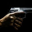 A man holds a gun at the Calibre 12 shooting club in Rio de Janeiro