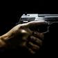 A man holds a gun at the Calibre 12 shooting club in Rio de Janeiro