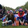 Sophie Smith, Oliver Smith, and Scott Vallely from Winchester sit at Hyde Park on the day of Britain’s King Charles’ coronation ceremony, in London, Britain May 6, 2023. REUTERS/Emilie Madi.