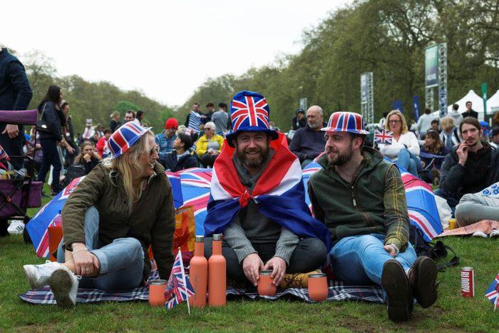 Sophie Smith, Oliver Smith, and Scott Vallely from Winchester sit at Hyde Park on the day of Britain’s King Charles’ coronation ceremony, in London, Britain May 6, 2023. REUTERS/Emilie Madi.