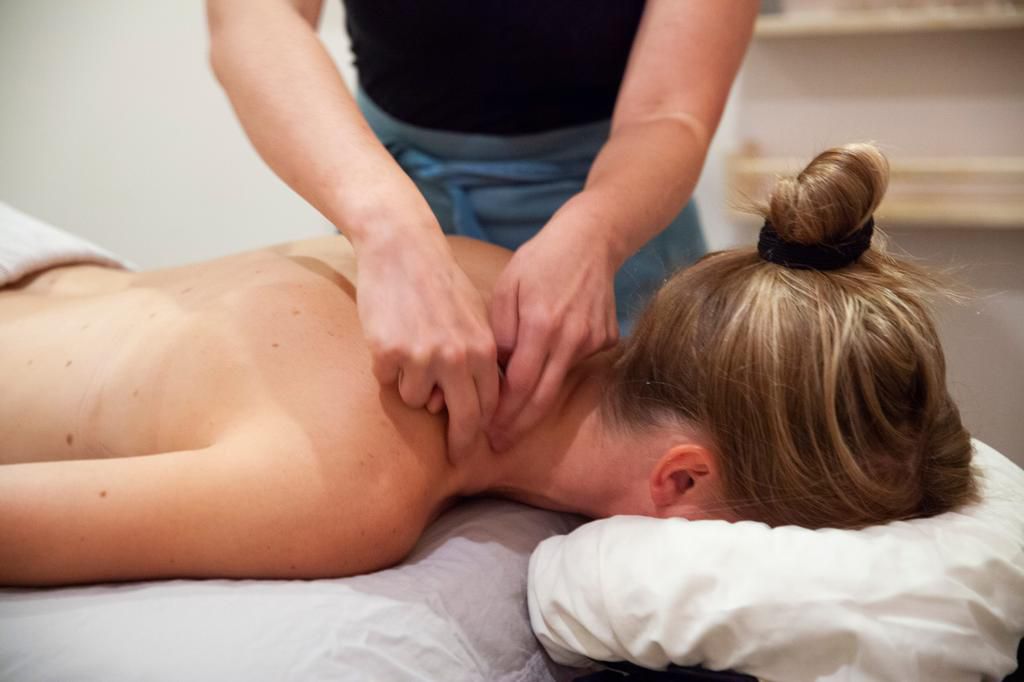 First, I took off my shirt and bra and lay face-down on a heated massage table. I love massages, so the spa-like atmosphere of the studio was immediately relaxing.