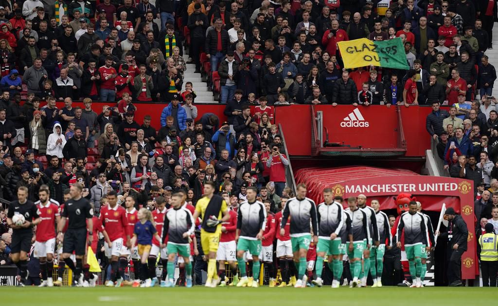 A Glazers out flag appears as the teams walk out during the Premier League match at Old Trafford on October 16, 2022.