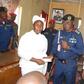 The Representative of Commandant General NSCDC presenting cheque to one of the next of kin on Thursday in Kaduna.