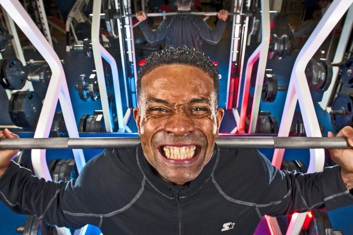 A man lifting weights at the gym