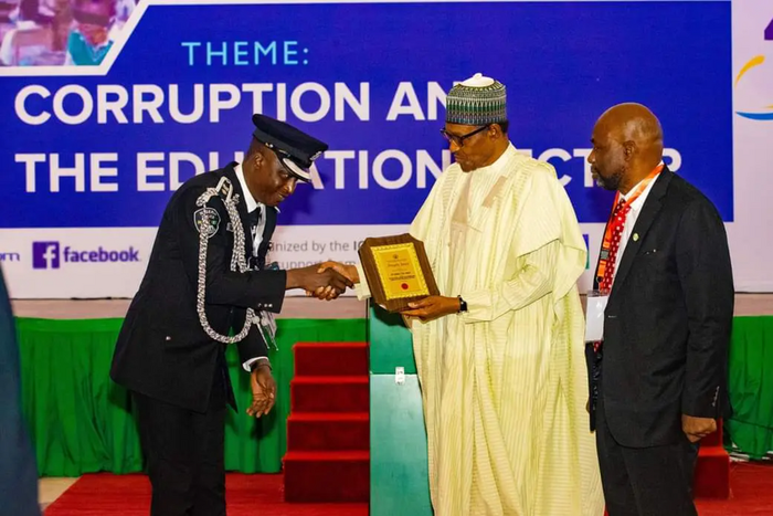 President Muhammadu Buhari awarding CSP Daniel Amah at the Villa, Abuja recently