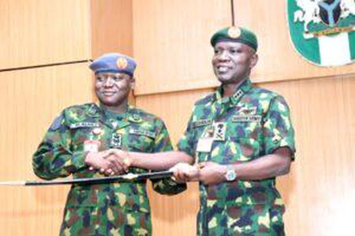 (L-R) Commandant AFCSC, AVM Hassan Alhaji presenting a sword to the Chief of Army Staff, Lt-Gen Taoreed Lagbaja, in Jaji on Tuesday [NAN]