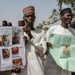 Parents and relatives hold portraits of their girls during a commemoration five years after they were abducted by Boko Haram Jihadists who stormed the Chibok girls' boarding school