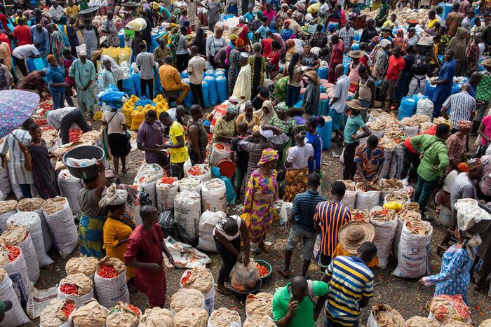 A sea of vendors and customers navigate Mile 12 International Market.