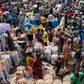 A sea of vendors and customers navigate Mile 12 International Market.