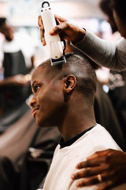A man getting a haircut in a barbershop