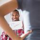 Man showing 'I'm Sorry' sign to angry girlfriend