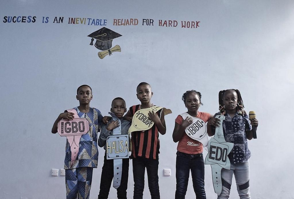 School kids aking a tribal presentation at PTA [Weebly/Ima Elijah]