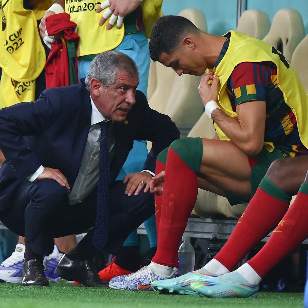 Fernando Santos speaking to Ronaldo before he came on against Switzerland.