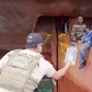 Four Nigerian stowaways embarked on a  journey across the vast Atlantic Ocean, clinging to a tiny space above the rudder of a cargo ship [Reuters]