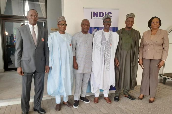 L-R: Director, Communication and Corporate Affairs, NDIC, Bashir Nuhu, Executive Director Operations, NDIC, Mustapha Ibrahim, President, Nigeria Guild of Editors, Managing Director/Chief Executive Officer, NDIC, Bello Hassan, President, Nigeria Guild o...