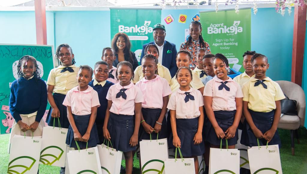 L-R: Director, Bloomy Berries Nursery and Primary School, Mrs. Oliver; Lead, Retail Banking and Customer Acquisition,9 Payment Service Bank, Oladimeji Saka; Head, Human Resources, 9 Payment Service Bank, Alex Nneka Ohai and some pupils.