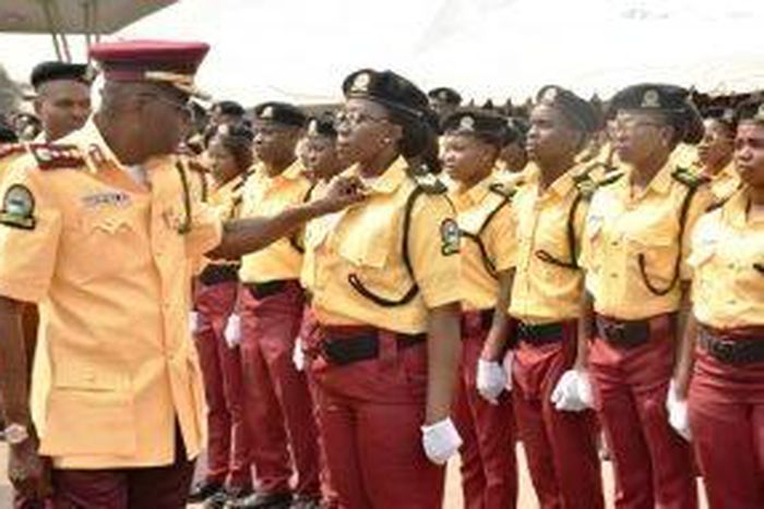 Gov. Babajide Sanwo-Olu of Lagos State adjusting the collar of one of the newly recruited officials of Lagos State Traffic Management Authority (LASTMA) during their passing out parade in Lagos on Wednesday (NAN)