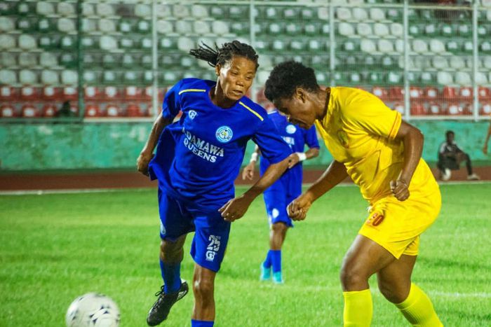 Adamawa queen player battling with Edo Queens player for the ball