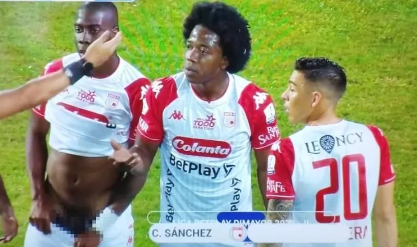 A blurred image of Perea flashing his penis