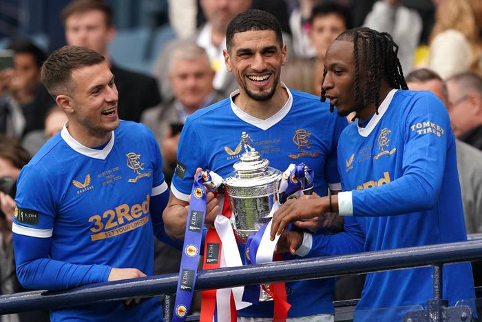 Rangers v Heart of Midlothian - Scottish Cup - Final - Hampden Park Rangers Aaron Ramsey, Leon Balogun and Joe Aribo (left-right) celebrate with the trophy following the Scottish Cup final at Hampden Park, Glasgow. Picture date: Saturday May 21, 2022.