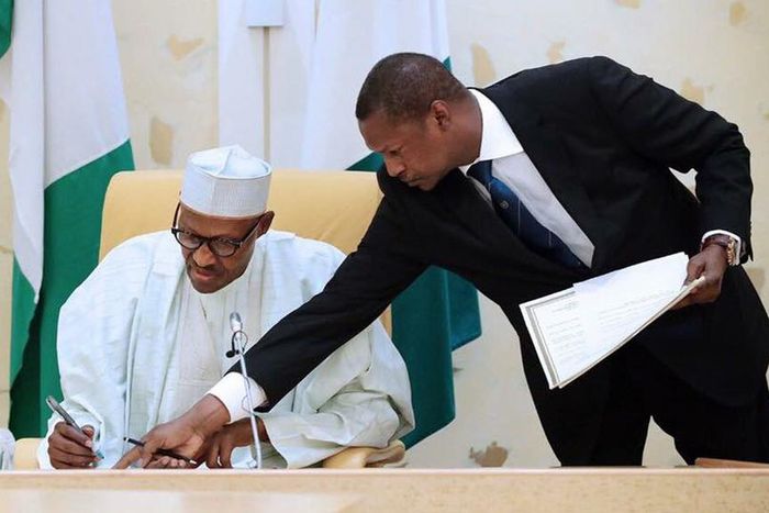 AGF Malami and President Buhari sign dotted lines