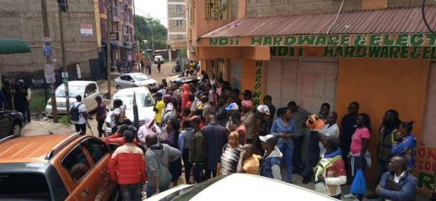 A crowd outside the building where a woman was found dead in an apartment reported to be an airbnb in Roysambu