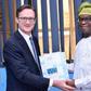 Managing Director of the News Agency of Nigeria (NAN), Buki Ponle (r) offering a souvenir of the agency to the new British High Commissioner to Nigeria, Mr Richard Montgomery (l) when the latter paid a courtesy call on the NAN MD in Abuja on Thursday, ...