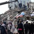 Rescuers and civilians look for survivors under the rubble of collapsed buildings in Kahramanmaras, Turkey. A 7.8-magnitude earthquake struck the country's southeast on February 7, 2023.ADEM ALTAN/AFP via Getty Images