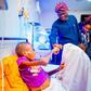 Lagos State governor, Babajide Sanwo-Olu, fistbumps boy with missing intestine, Adebola Akin-Bright [LASG]