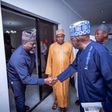 Mr Ade Omole (Left), Director of Diaspora Directorate of the defunct APC Presidential Campaign Council cPCC) in a handshake with President Bola Tinubu