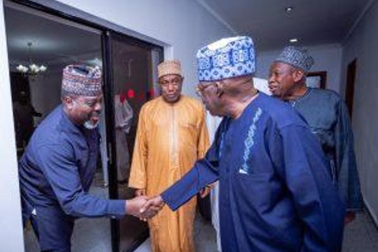 Mr Ade Omole (Left), Director of Diaspora Directorate of the defunct APC Presidential Campaign Council cPCC) in a handshake with President Bola Tinubu