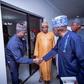 Mr Ade Omole (Left), Director of Diaspora Directorate of the defunct APC Presidential Campaign Council cPCC) in a handshake with President Bola Tinubu