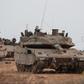 An Israeli tank and military vehicles near Israel's border with the Gaza Strip in southern Israel.Reuters