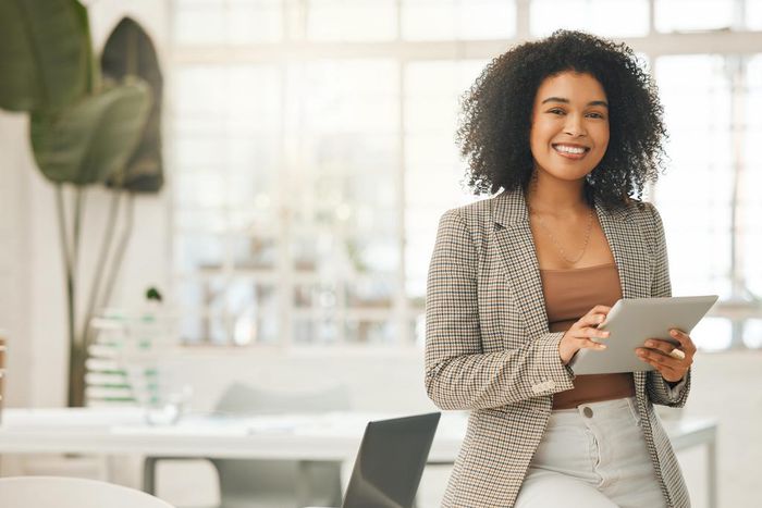 If your side hustle is already a thriving business, you tell your boss right away.PeopleImages/Getty