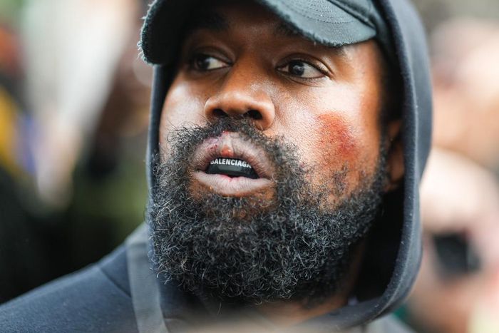 Ye, who is also known as Kanye West, is seen wearing a Balenciaga boxing mouthguard, outside Givenchy, during Paris Fashion Week.Edward Berthelot/GC Images