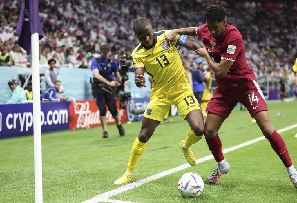 Enner Valencia (L) of Ecuador vies with Homam Ahmed of Qatar during the Group A match between Qatar and Ecuador at the 2022 FIFA World Cup on November 20, 2022.