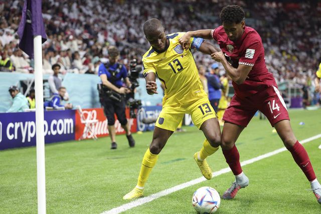 Enner Valencia (L) of Ecuador vies with Homam Ahmed of Qatar during the Group A match between Qatar and Ecuador at the 2022 FIFA World Cup on November 20, 2022.