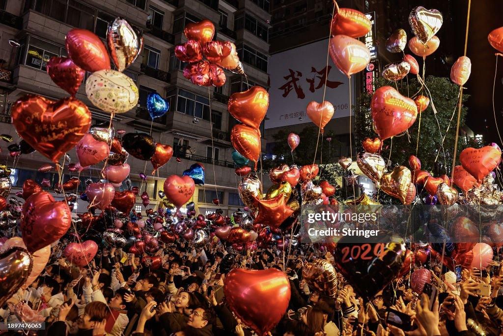 People release balloons into the air to celebrate the new year [GettyImages]