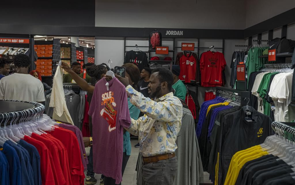 Customers browsing the value offer products at Nike's store in Circle Mall Lekki