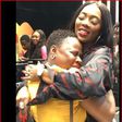 Tiwa savage hugging a fan