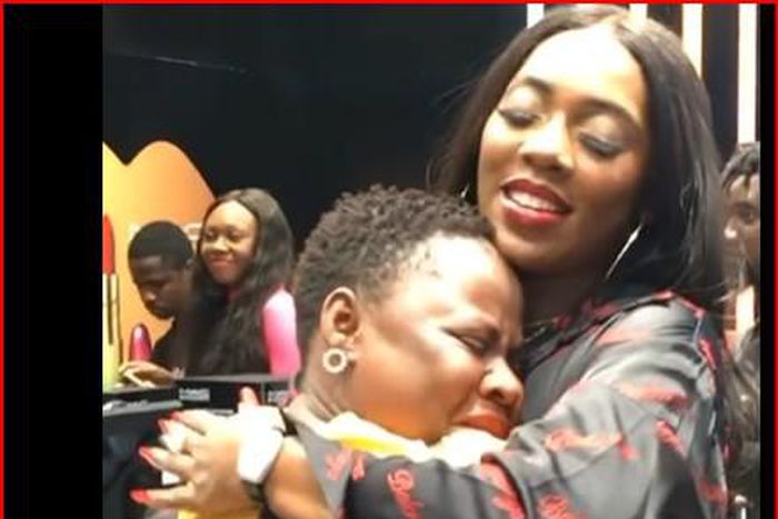 Tiwa savage hugging a fan