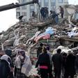 Rescuers and civilians look for survivors under the rubble of collapsed buildings in Kahramanmaras, Turkey. A 7.8-magnitude earthquake struck the country's southeast on February 7, 2023.ADEM ALTAN/AFP via Getty Images