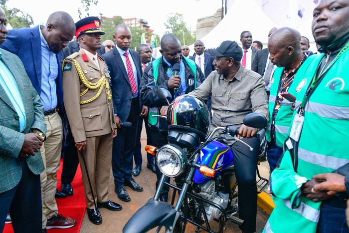 President William Ruto interacting with entrepreneurs during the launch of Hustler Fund in Nairobi on Wednesday, November 30, 2022