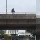 Man attempting to jump off Falomo Bridge [Ikejabird]