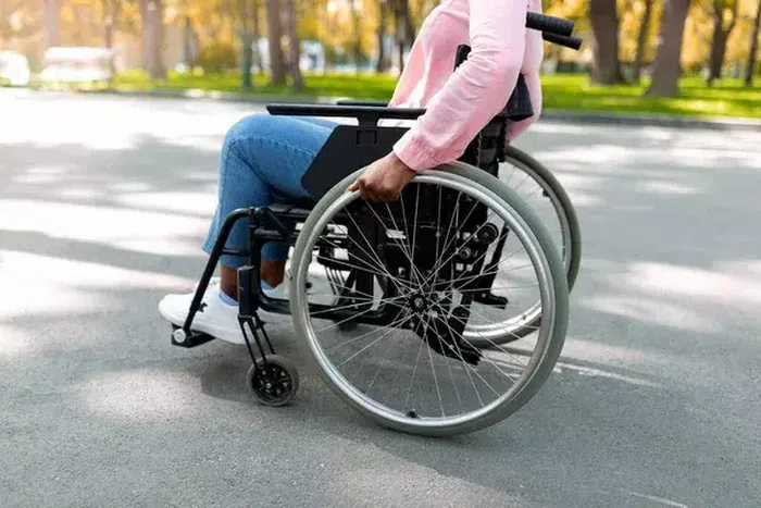 Handicapped black lady in wheel chair [Depositphotos]