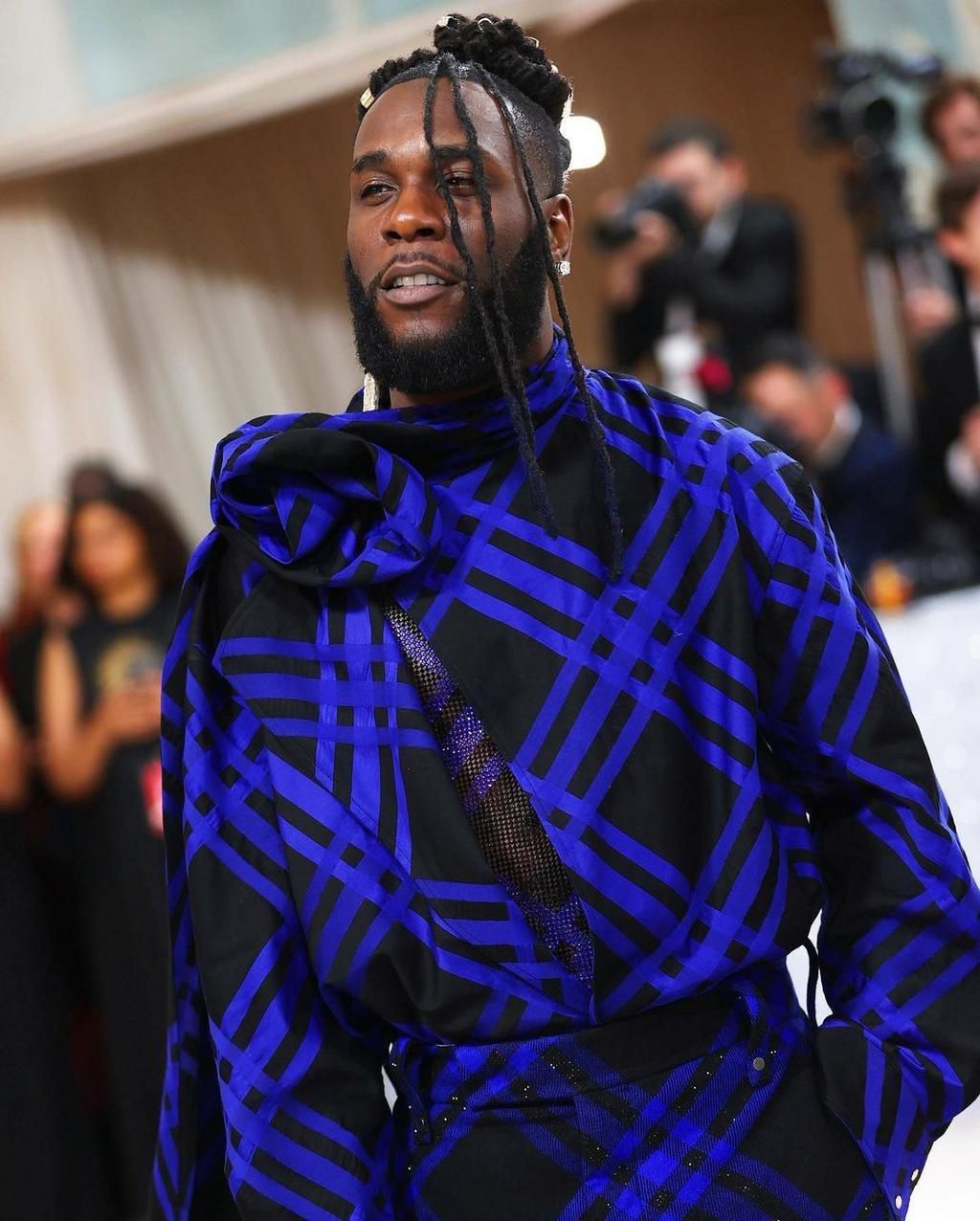 Burna Boy's outfit at the Met Gala has received praise from both fashion enthusiasts and fans, with many applauding his bold and stylish choice of attire.  [Yabaleftonline]